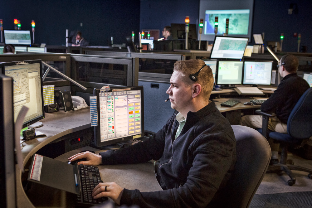 Air Methods employee working on computer. 